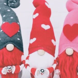 Three gnomes with red and white beards and valentine hats