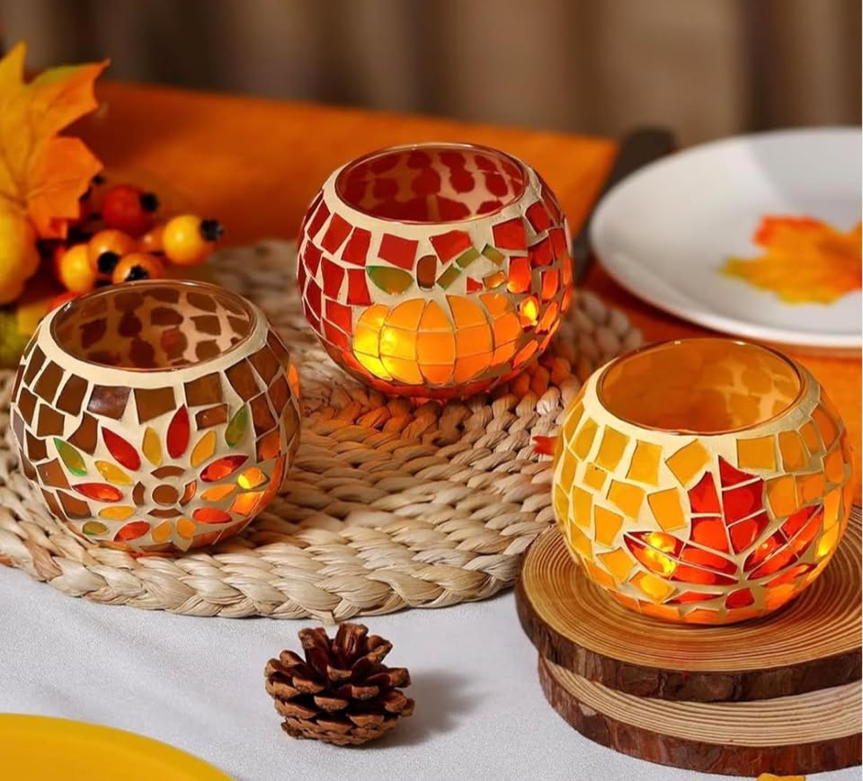 three small orange fall themed mosaic candle holders