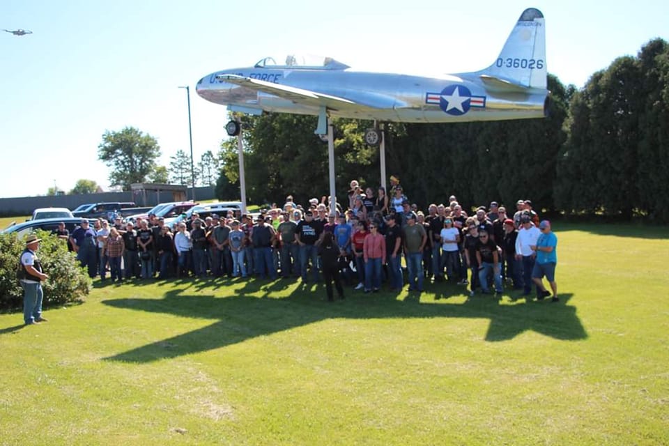 Veterans beneath a jet