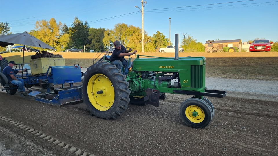 A john deer tractor at a tractor pull