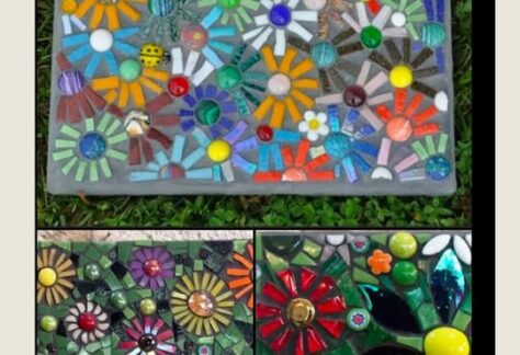 A picture of Mosaic Stepping Stones with flowers of different colors on them.