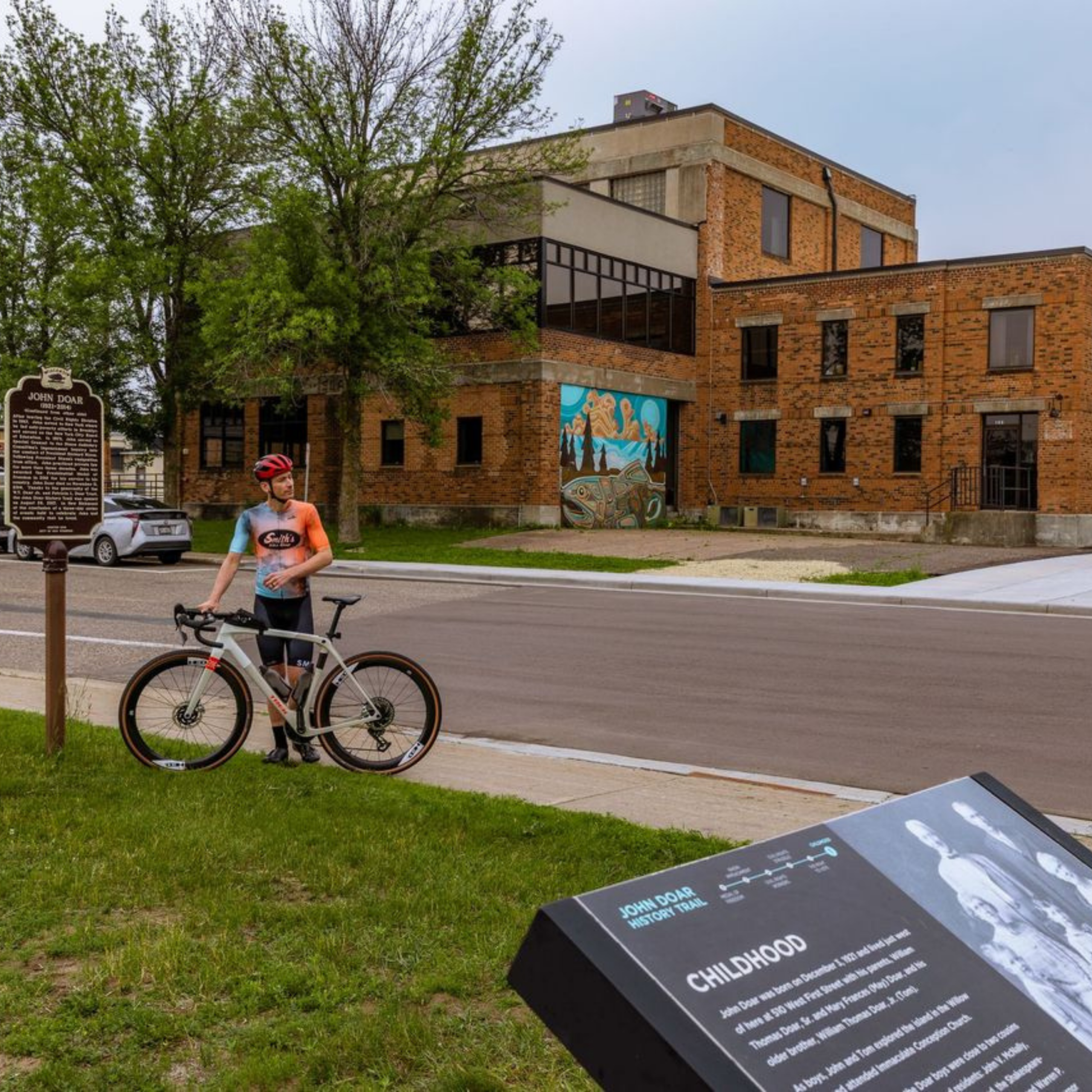 A biker taking a break in New Richmond’s historic district.<br />
