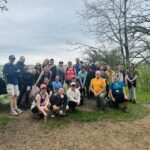 A group of hikers at an overlook in the Willow River State Park