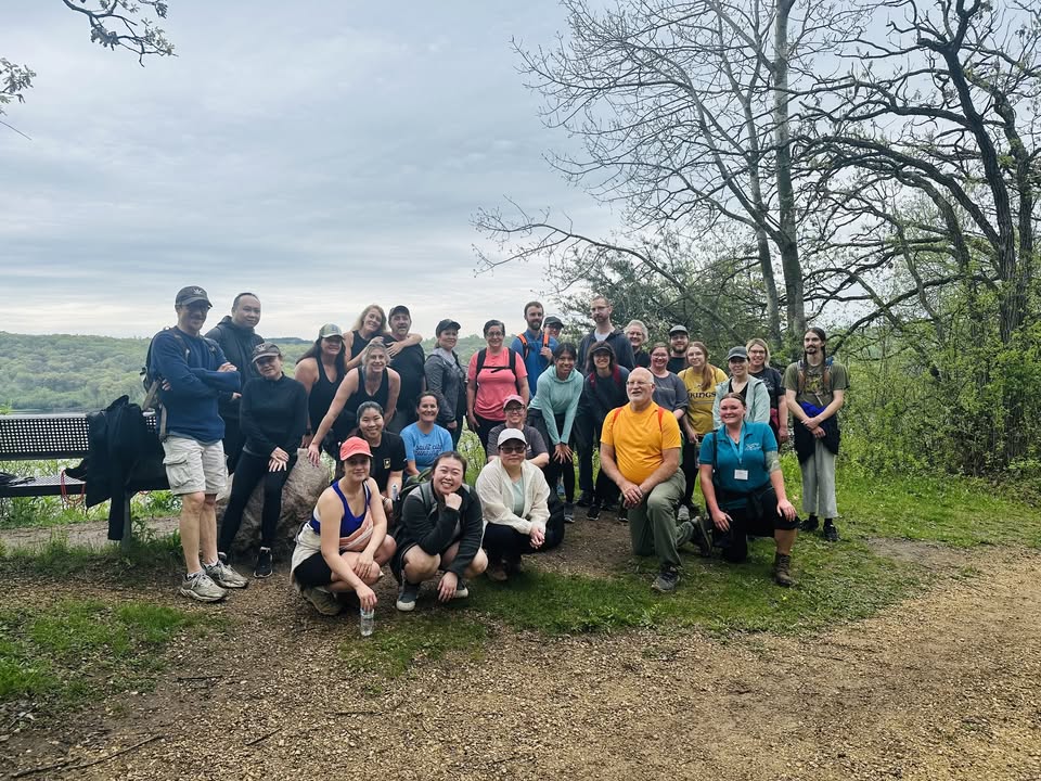 A group of hikers at an overlook in the Willow River State Park