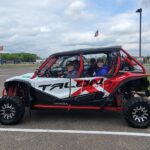 Group of people riding in an ATV