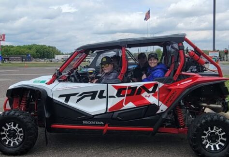 Group of people riding in an ATV