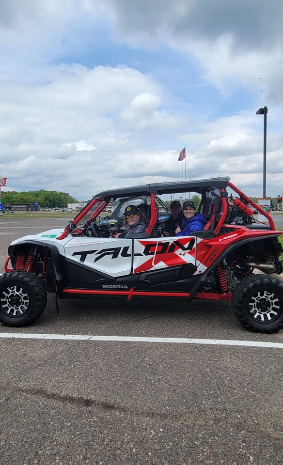 Group of people riding in an ATV