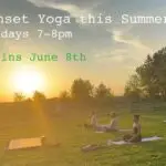 A group does yoga at the farm.