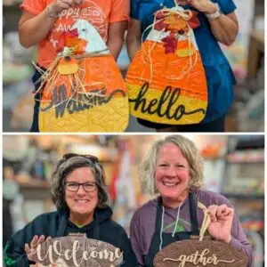 Women holding both acorn and candy corn shaped wall hangers