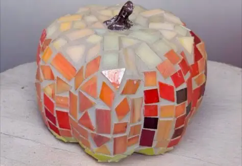 A 6 inch pumpkin covered in mosaic glass